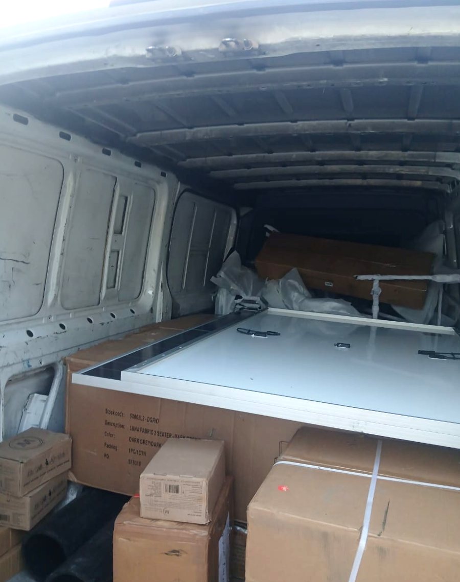 Panel van loaded with furniture boxes, parcels and specialist goods