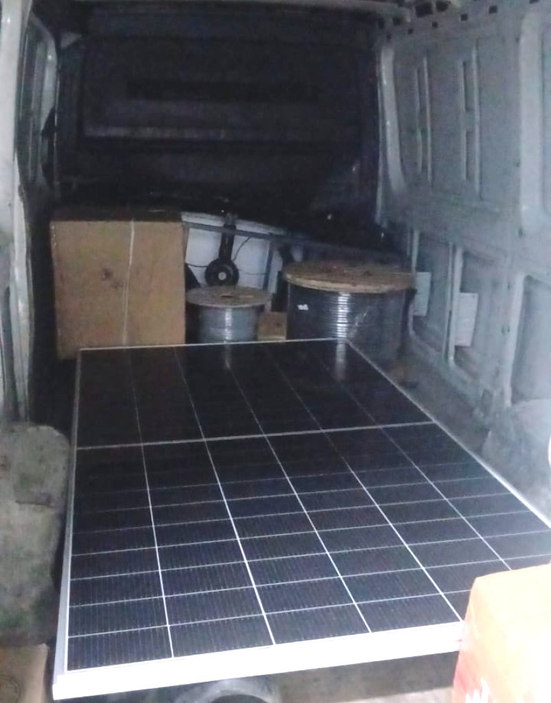 Solar panel and cable reels loaded in a delivery van